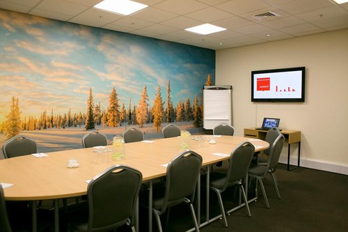A meeting room inside chill factore, with an image of a snowy landscape on the back wall